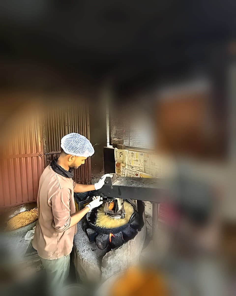 Rajguru Snacks — traditional coal-fired kadhai still used today